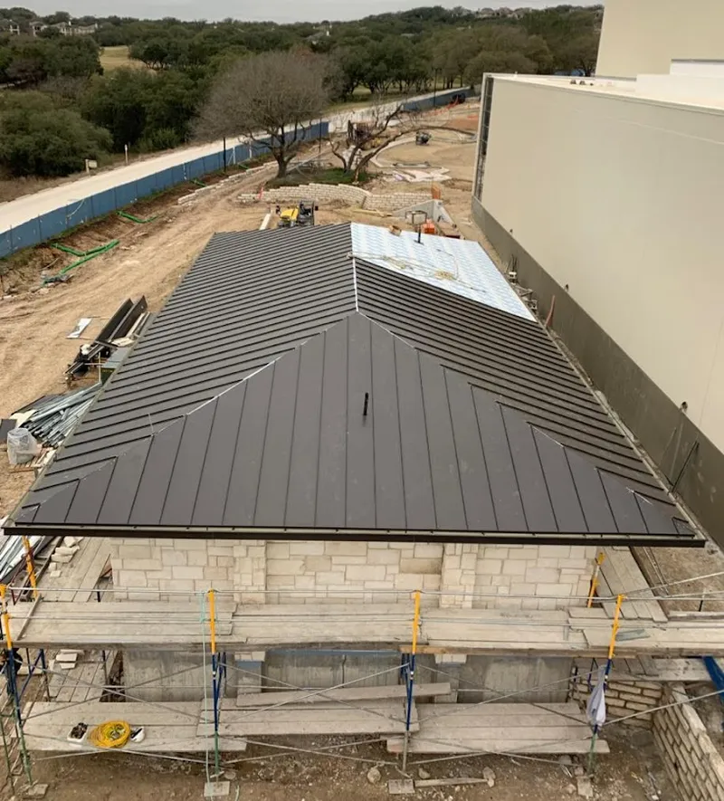 Metal roof new construction with scaffolding in Ambridge